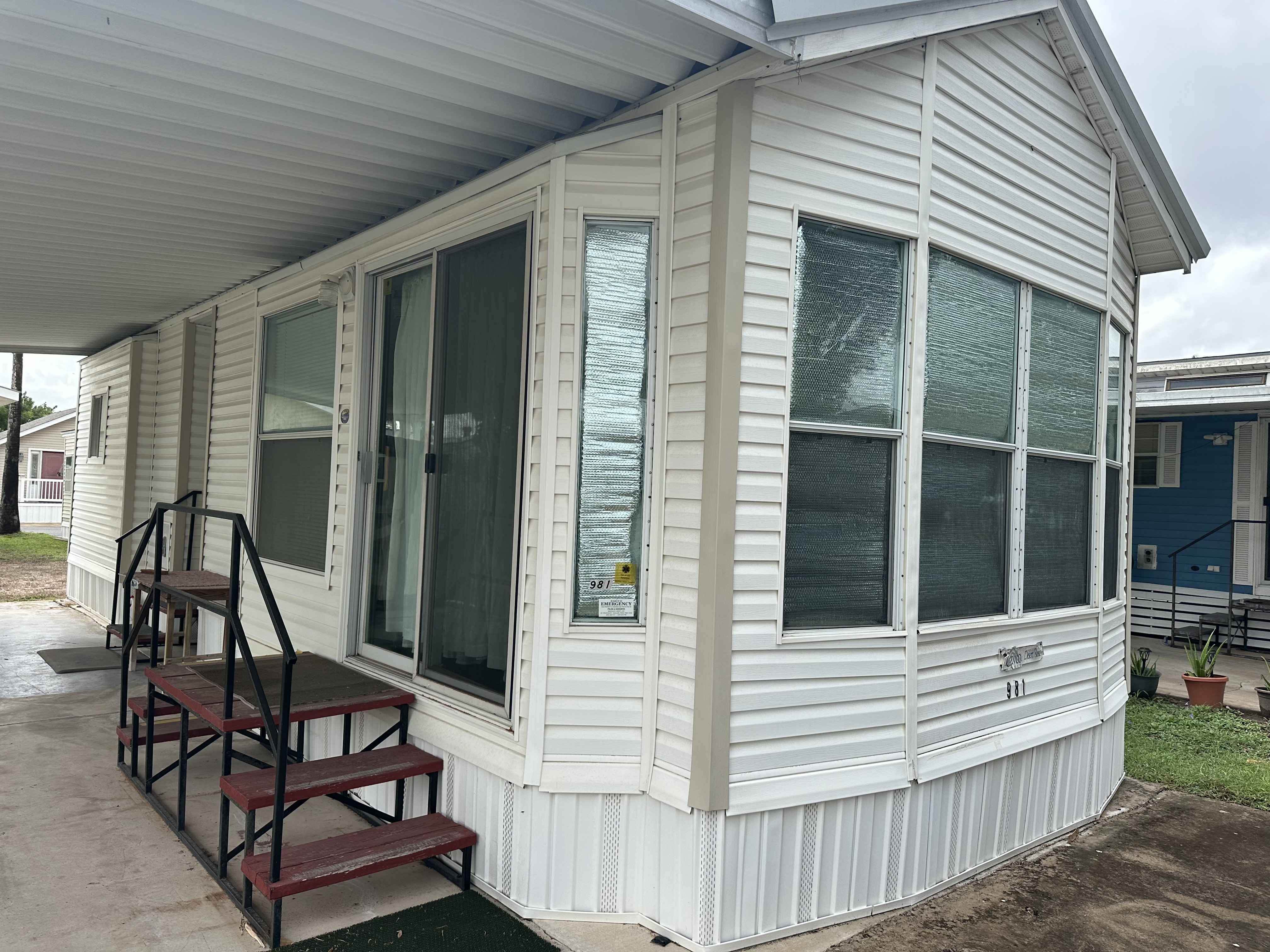 Manufactured home exterior with porch